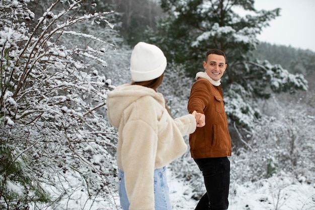 Medium shot couple holding hands