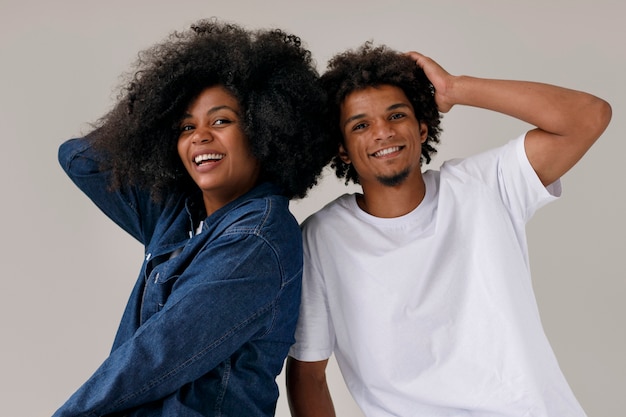 Medium shot couple with afro hairstyles