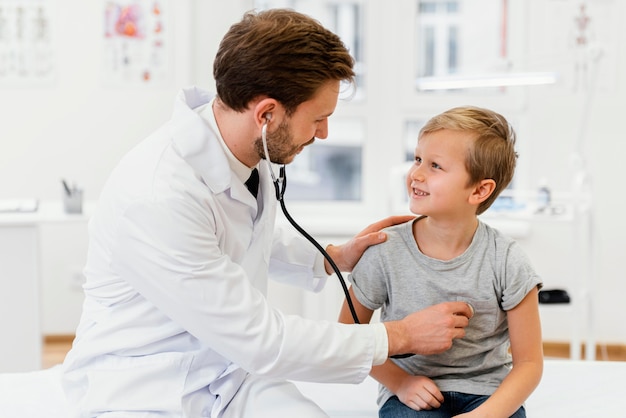 Medium shot doctor checking kid