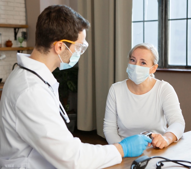 Medium shot doctor checking patient