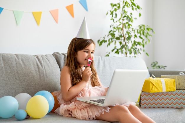 Medium shot girl holding laptop