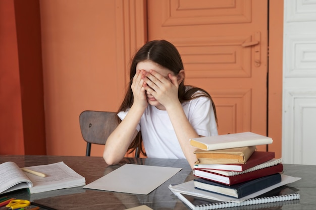 Medium shot girl with adhd at desk