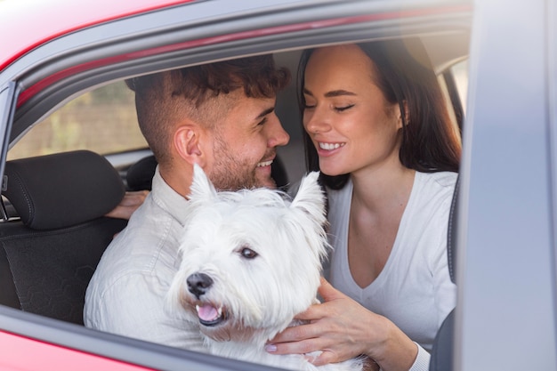 Medium shot happy couple with cute dog