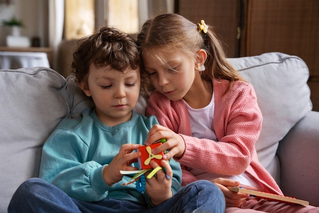 Medium shot kids playing memory game