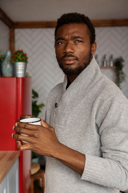 Medium shot man holding cup