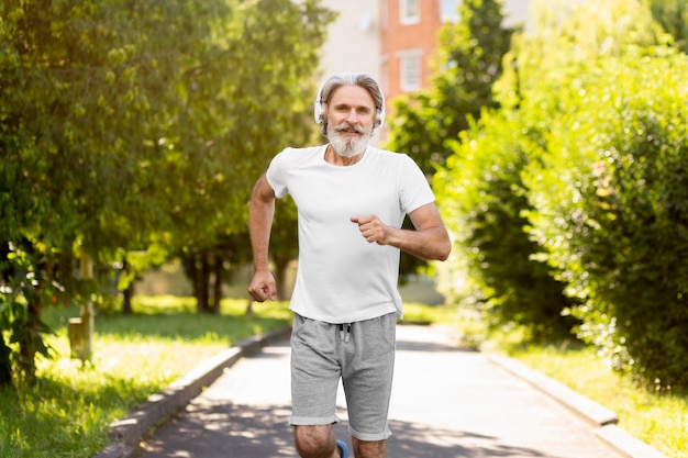 Medium shot man running outdoors