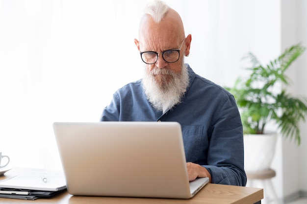 Medium shot man sitting at desk