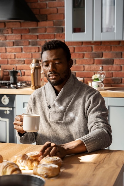 Medium shot man sitting at table