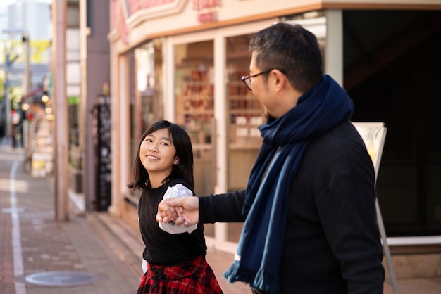 Medium shot man and woman holding hands