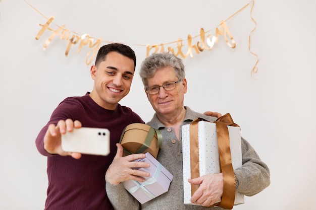 Medium shot men taking selfie