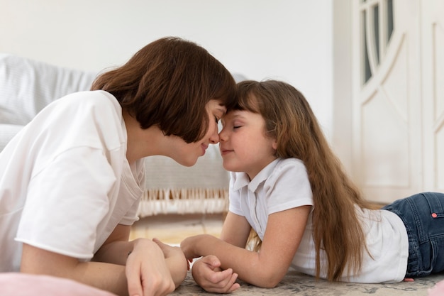 Medium shot mother and girl spending time together