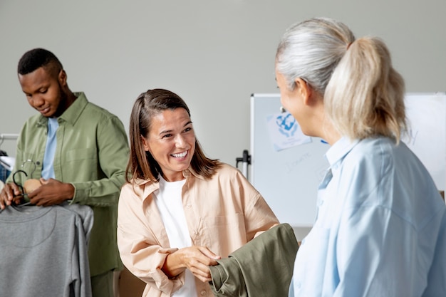 Medium shot people holding clothes