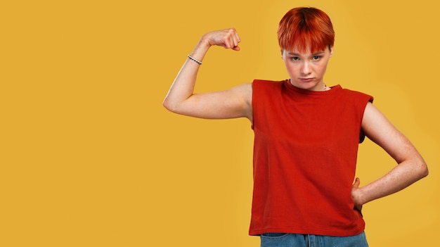 Medium shot queer woman posing with copy space