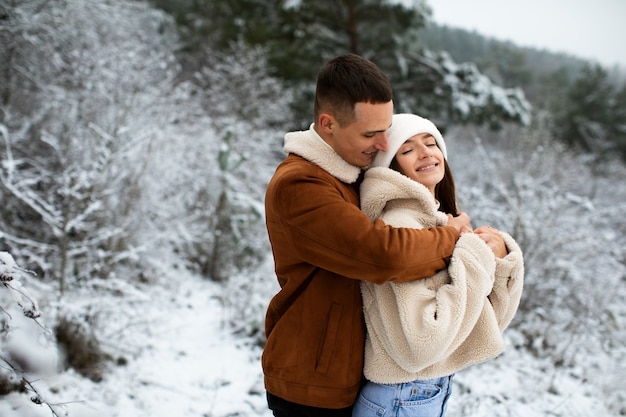 Medium shot romantic couple outdoors