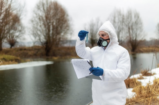 Medium shot scientist wearing gas mask