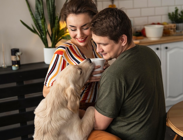 Medium shot smiley couple with cute dog