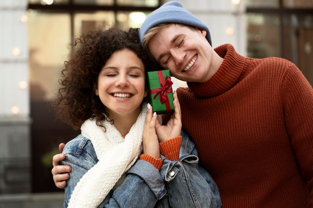 Medium shot smiley people with gift