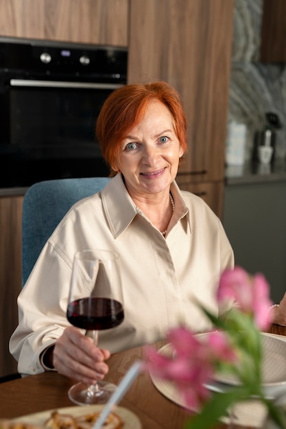 Medium shot smiley woman holding cup