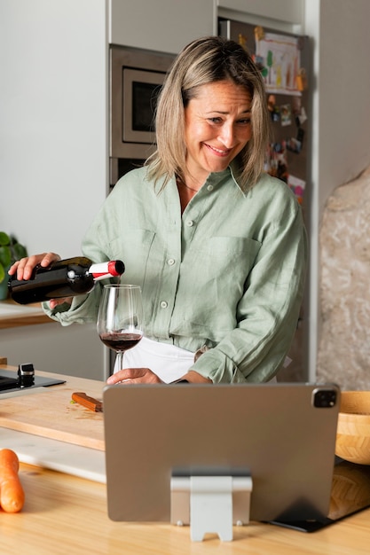 Medium shot smiley woman pouring wine