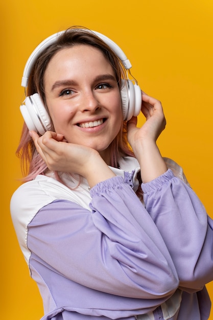 Medium shot smiley woman with headphones