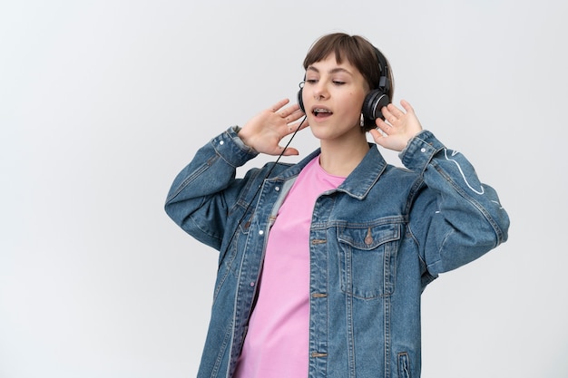 Medium shot teenager with headphones