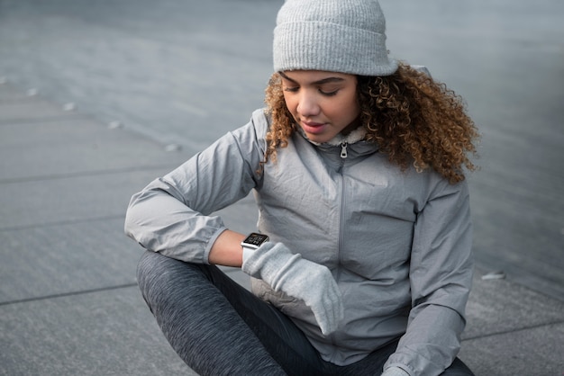 Medium shot woman checking watch