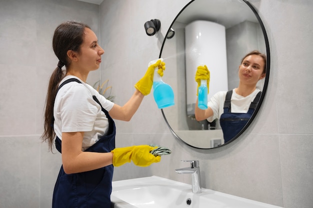 Medium shot woman cleaning home