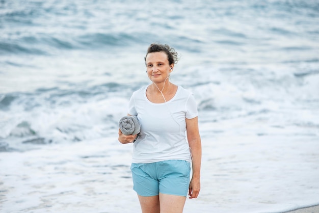 Medium shot woman holding towel