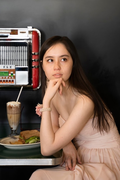 Medium shot woman sitting at table