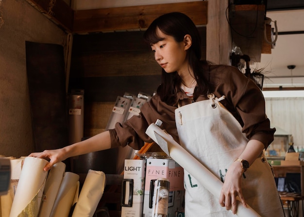 Medium shot woman wearing apron