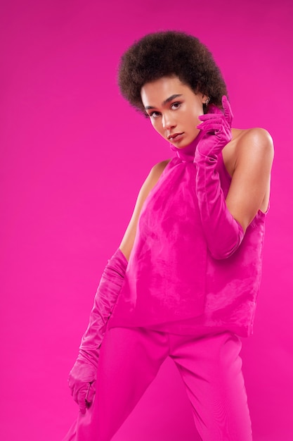 Medium shot woman wearing full pink outfit