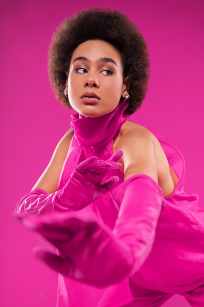 Medium shot woman wearing full pink outfit