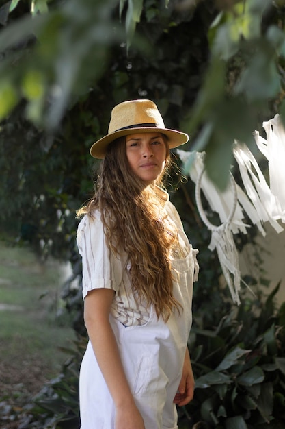 Medium shot woman wearing hat