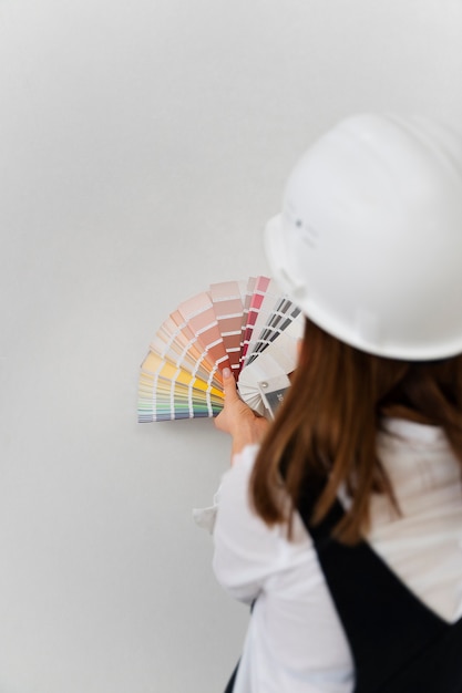 Medium shot woman wearing helmet