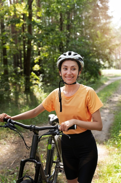 Medium shot woman wearing helmet