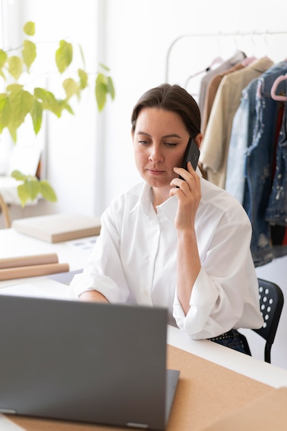 Medium shot woman with laptop