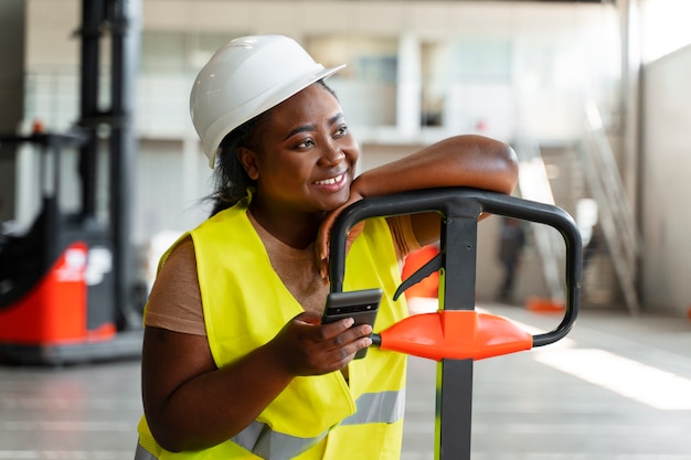 Medium shot woman working in construction