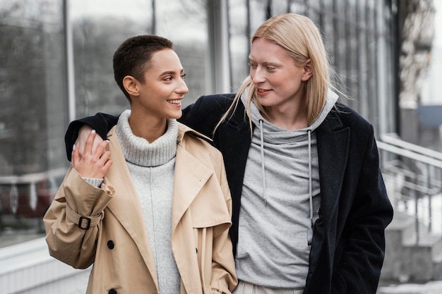 Medium shot women holding hands