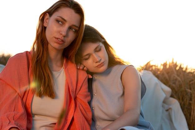 Medium shot women sitting together