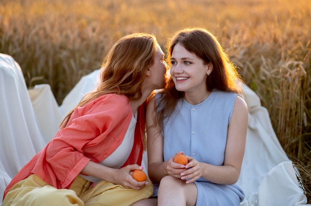 Medium shot women sitting together