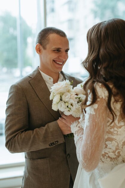 meeting of the bride and groom on the hotel stairs