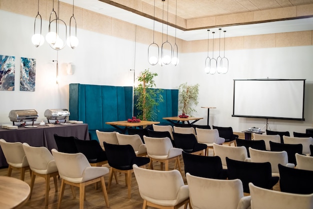 Meeting conference room with blank empty mockup screen for advertising