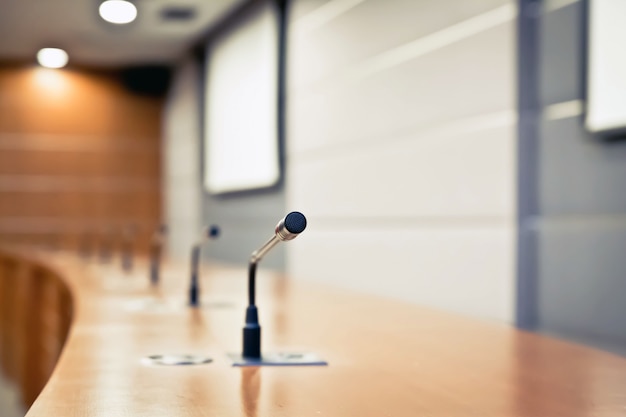 Photo meeting microphone on the table in the meeting room.