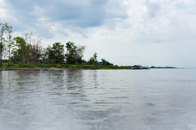 Meeting of Waters Rio Negro and Rio Solimoes confluence near Manaus Brazilian landmark