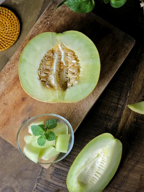 Melon which is sliced ​​in half on the table