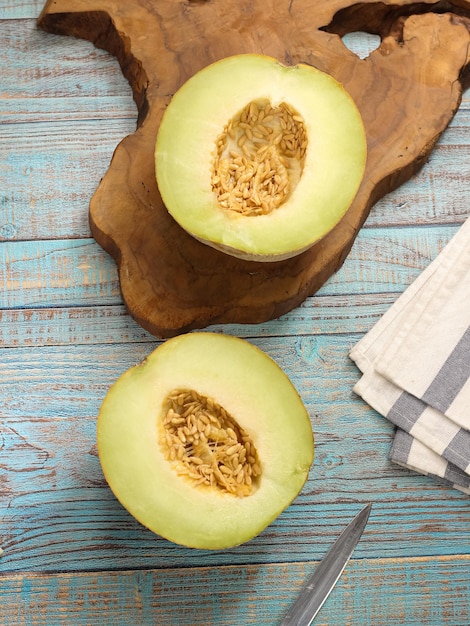 Melon which is sliced ​​in half on the table