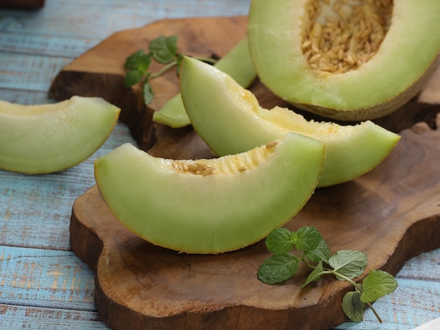 Melon which is sliced ​​in half on the table