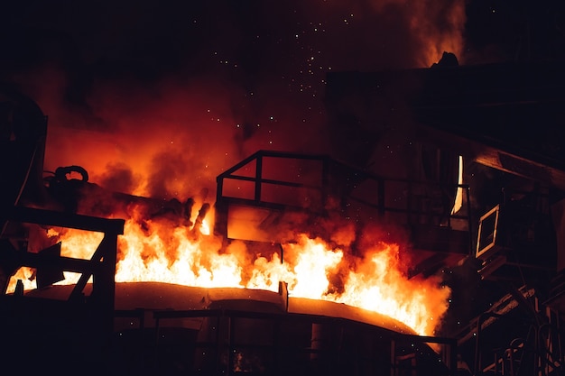 Melting of metal in a steel plant. High temperature in the melting furnace.