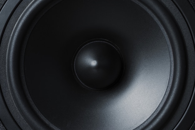 Membrane sound speaker on black, close up