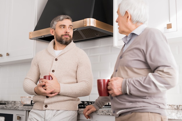 Men Chatting in Kitchen